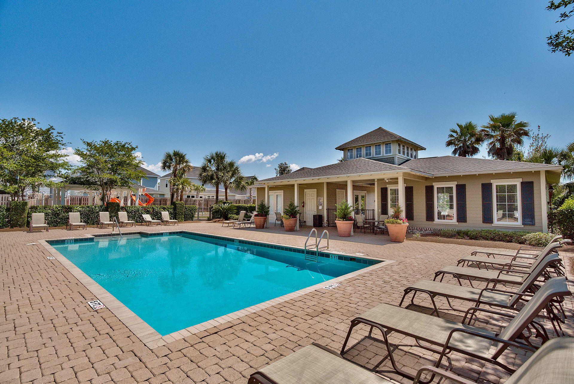 100 South Zander Way Santa Rosa Beach, FL 32459 - Photo 34 of 40 a view of a house with swimming pool and sitting area