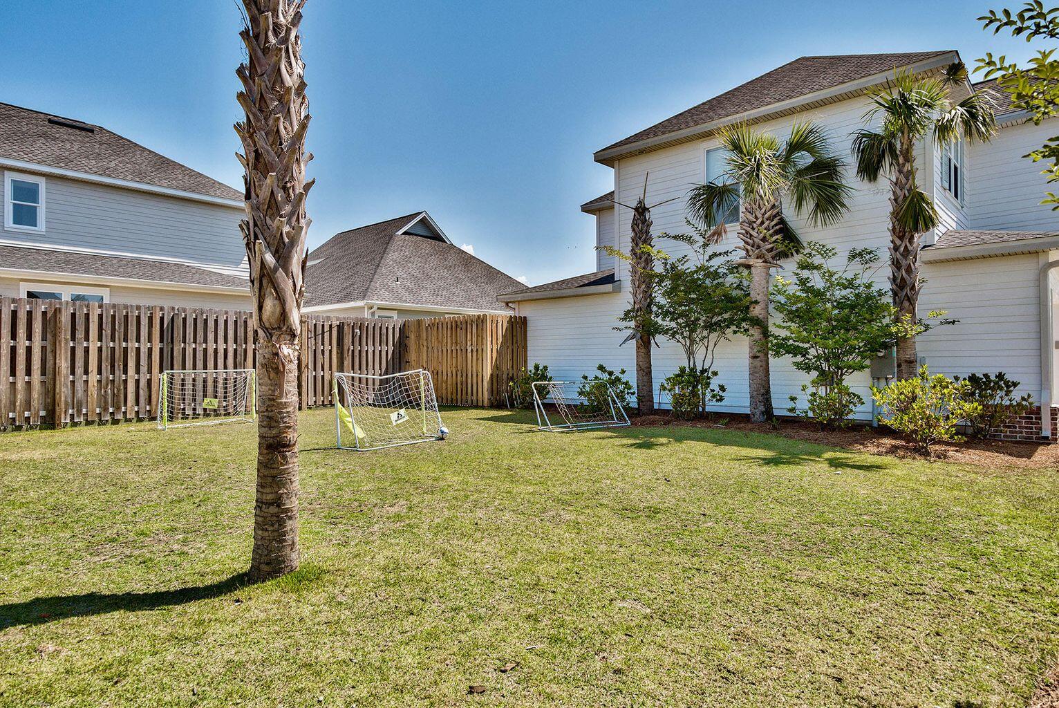 100 South Zander Way Santa Rosa Beach, FL 32459 - Photo 38 of 40 a front view of a house with garden