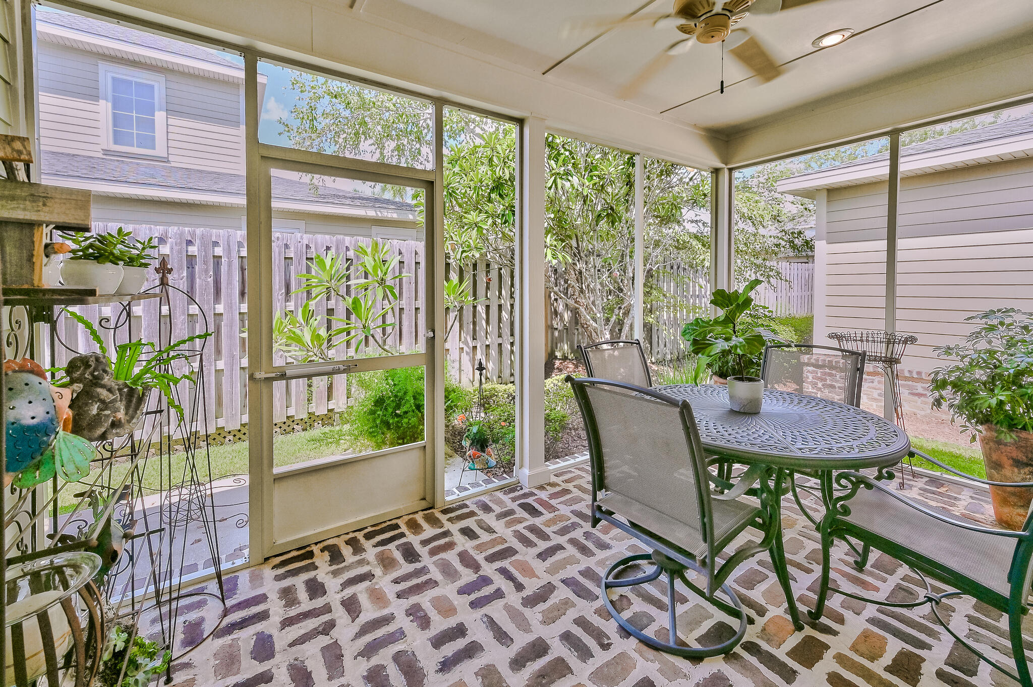 100 South Zander Way Santa Rosa Beach, FL 32459 - Photo 5 of 40 a view of a porch with furniture and a yard