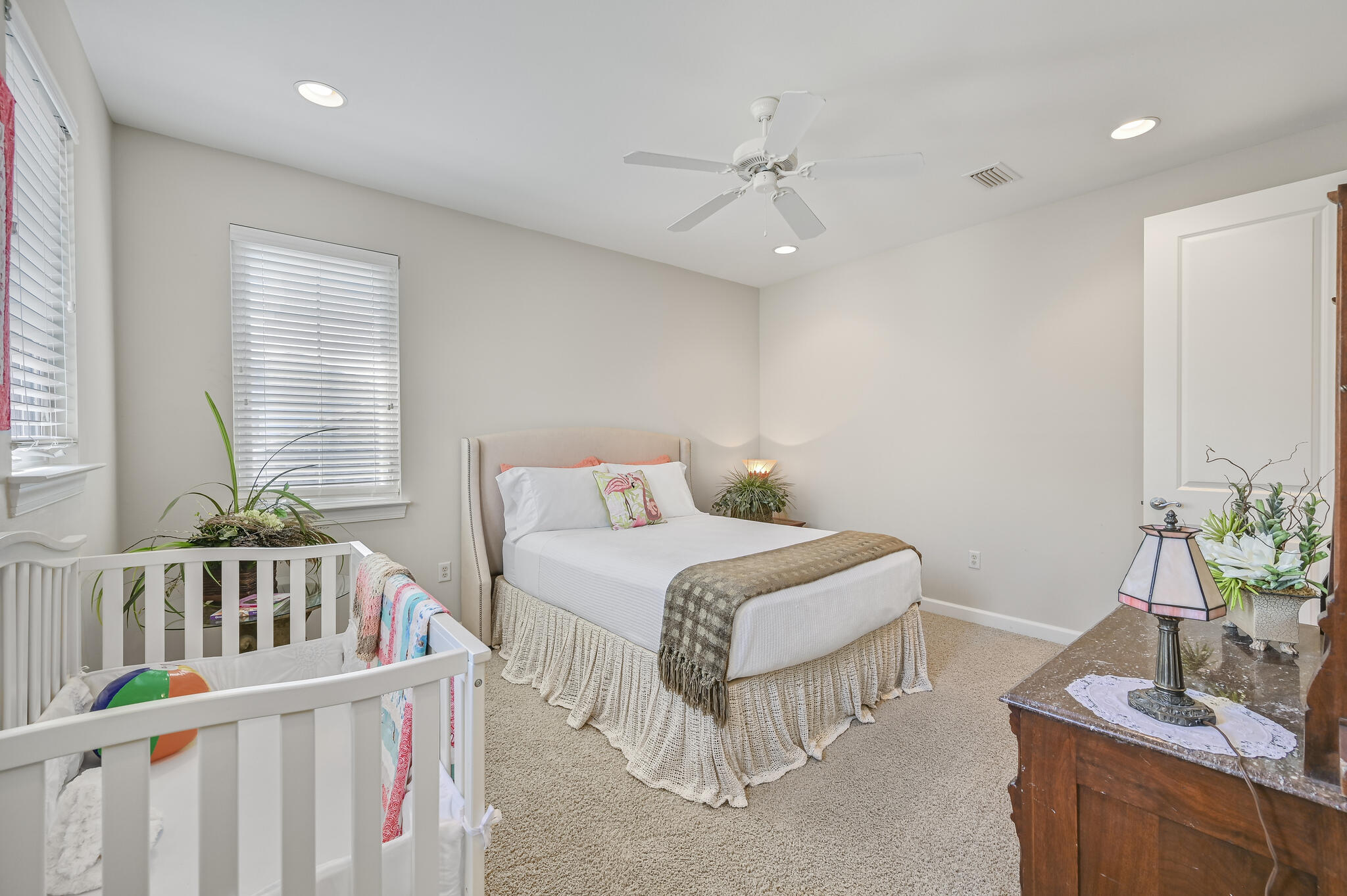 100 South Zander Way Santa Rosa Beach, FL 32459 - Photo 6 of 40 a bedroom with a bed and a table chair