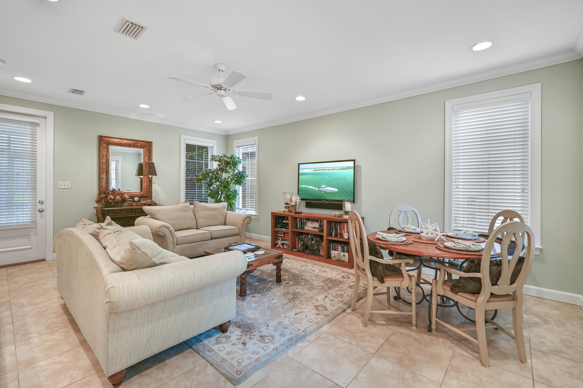 100 South Zander Way Santa Rosa Beach, FL 32459 - Photo 9 of 40 a living room with furniture a flat screen tv and a window