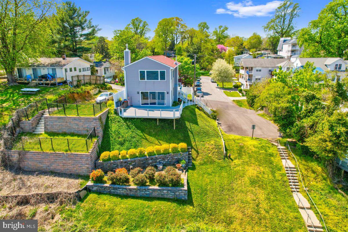 7517 B Street Chesapeake Beach, MD 20732 - Photo 12 of 78 a view of a house with a yard and potted plants