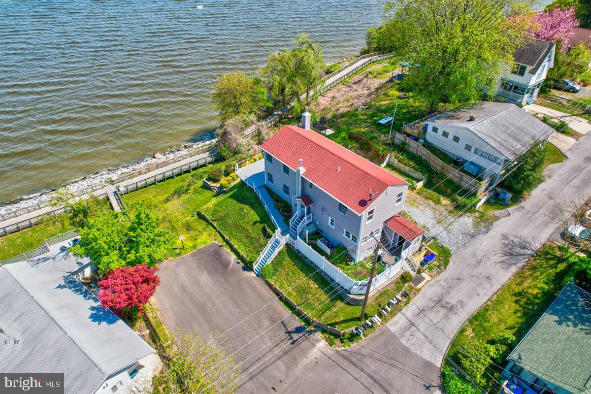 7517 B Street Chesapeake Beach, MD 20732 - Photo 15 of 78 an aerial view of a house with a garden and swimming pool
