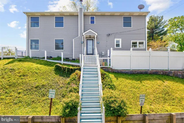 a view of a livingroom with furniture window and wooden floor