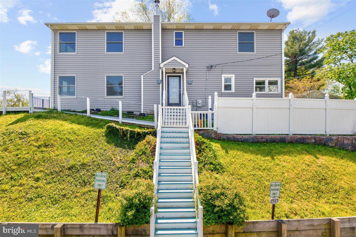 7517 B Street Chesapeake Beach, MD 20732 - Photo 25 of 78 a front view of a house with a yard