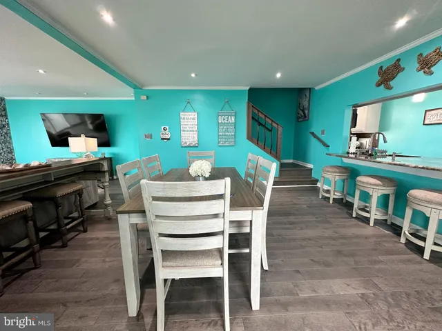 a bedroom with furniture and a wooden floor