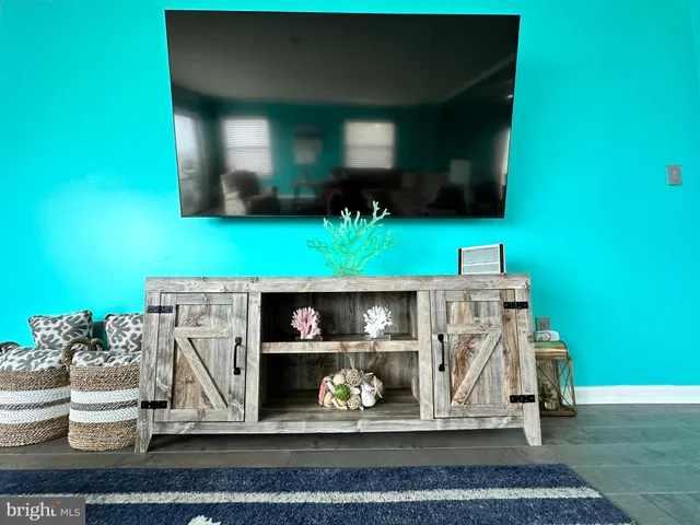 a bathroom with a granite countertop toilet sink and mirror