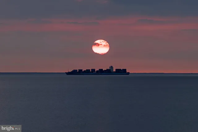 a view of swimming pool with outdoor seating and yard