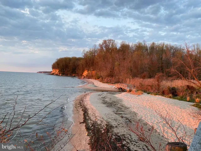 a aerial view of a house with a yard and sitting area