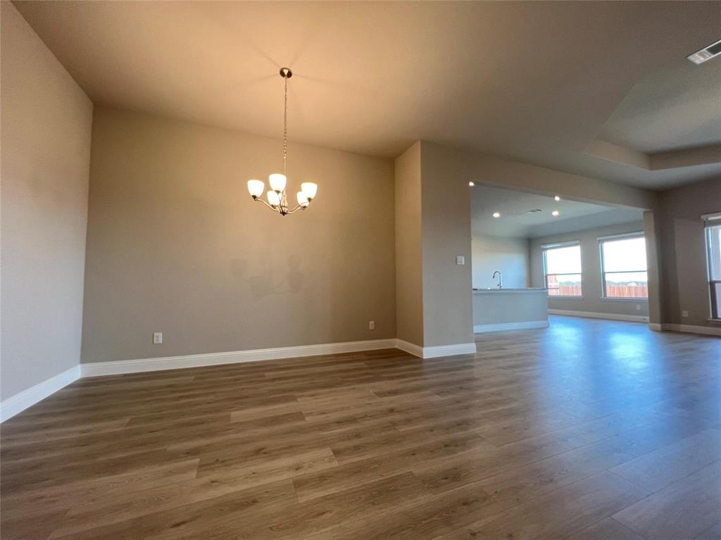 3611 Walnut Rdg Drive Midlothian, TX 76065 - Photo 12 of 29 a view of an empty room with window and wooden floor