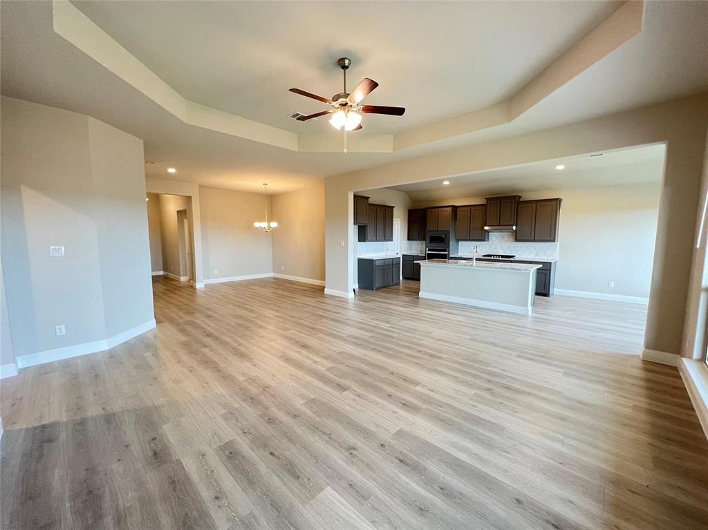 3611 Walnut Rdg Drive Midlothian, TX 76065 - Photo 13 of 29 a view of a kitchen with wooden floor and a ceiling fan