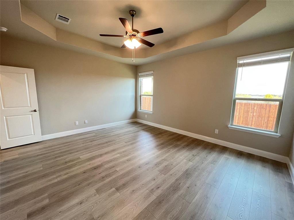 3611 Walnut Rdg Drive Midlothian, TX 76065 - Photo 15 of 29 a view of an empty room with wooden floor and a window