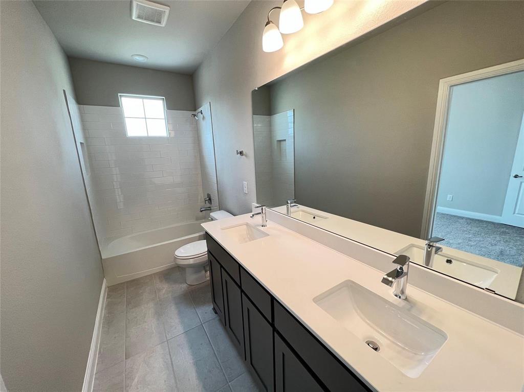3611 Walnut Rdg Drive Midlothian, TX 76065 - Photo 23 of 29 a bathroom with a sink a toilet and shower