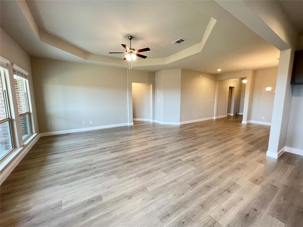 3611 Walnut Rdg Drive Midlothian, TX 76065 - Photo 10 of 29 a view of an empty room with wooden floor and a window