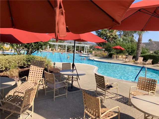 an outdoor space with furniture and umbrella