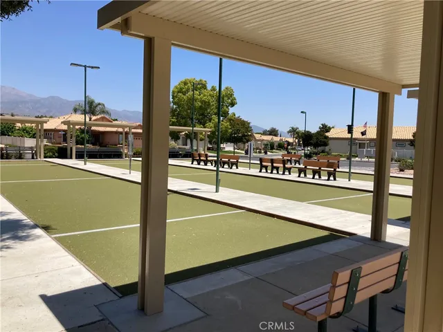 a view of a swimming pool and outdoor seating