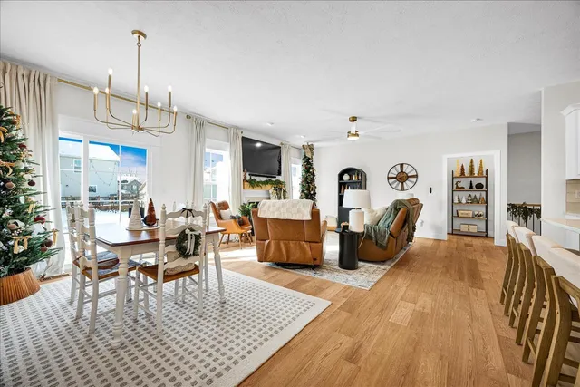 a living room with furniture a rug and a chandelier