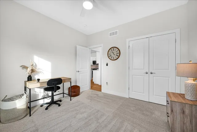 a workspace with furniture and window