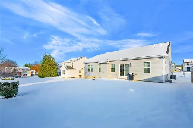 a view of a house with swimming pool in front of house