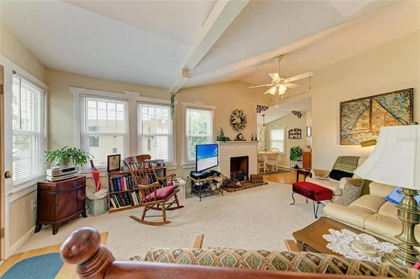 a view of a livingroom with furniture and a window