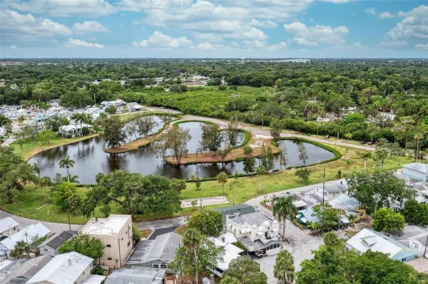 a view of a lake with a house in the background