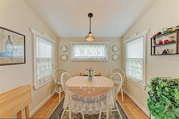 a dining room with furniture and window