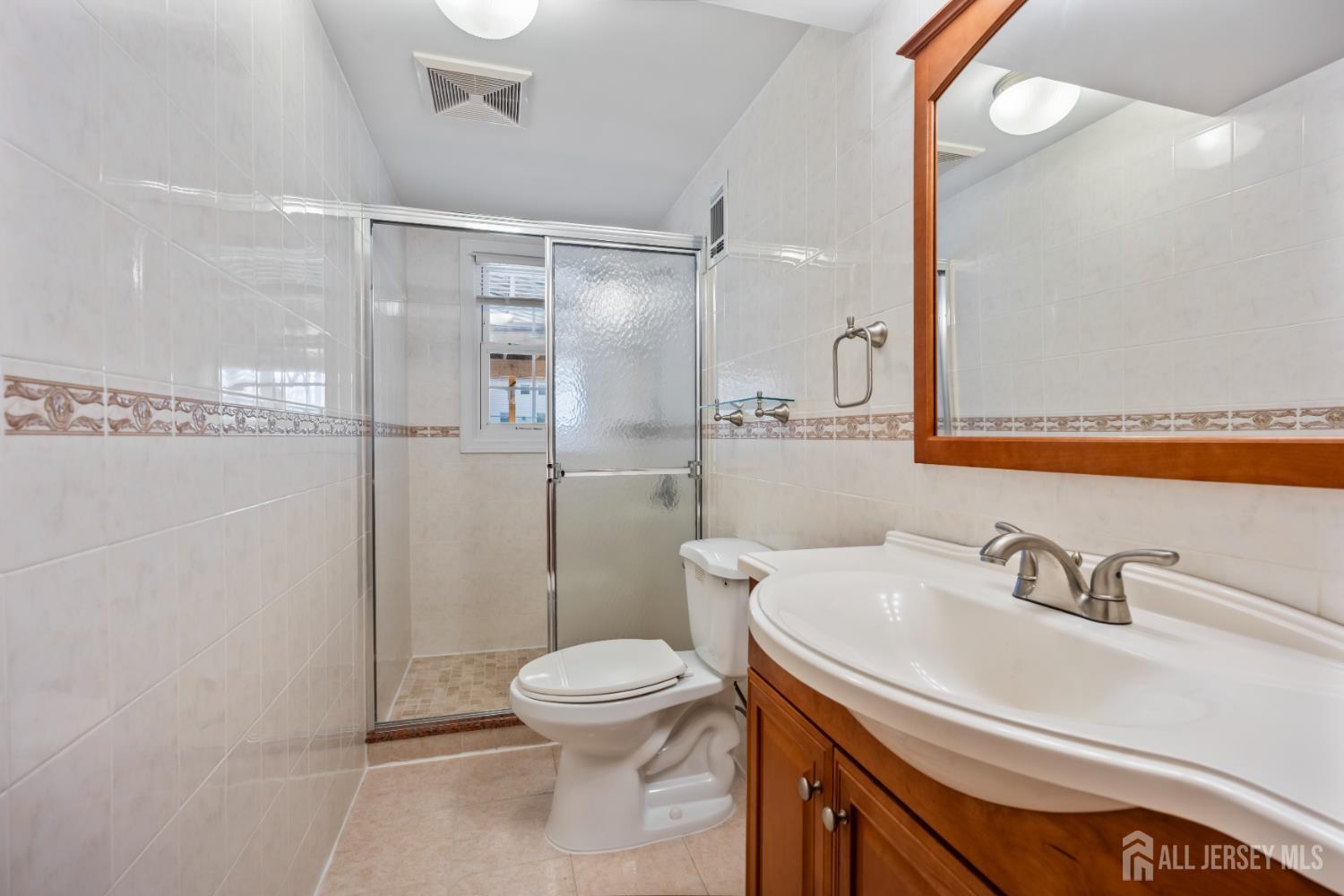 8 Tompkins Road East Brunswick, NJ 08816 - Photo 12 of 22 a bathroom with a sink toilet and shower