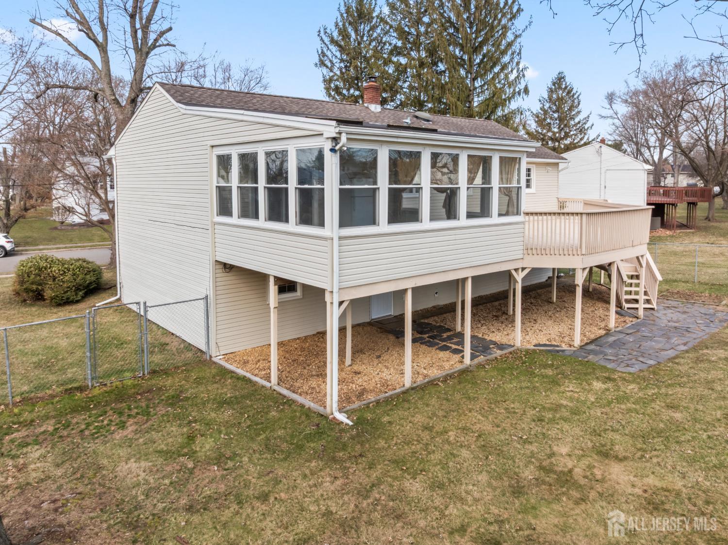 8 Tompkins Road East Brunswick, NJ 08816 - Photo 14 of 22 a view of a house with a backyard