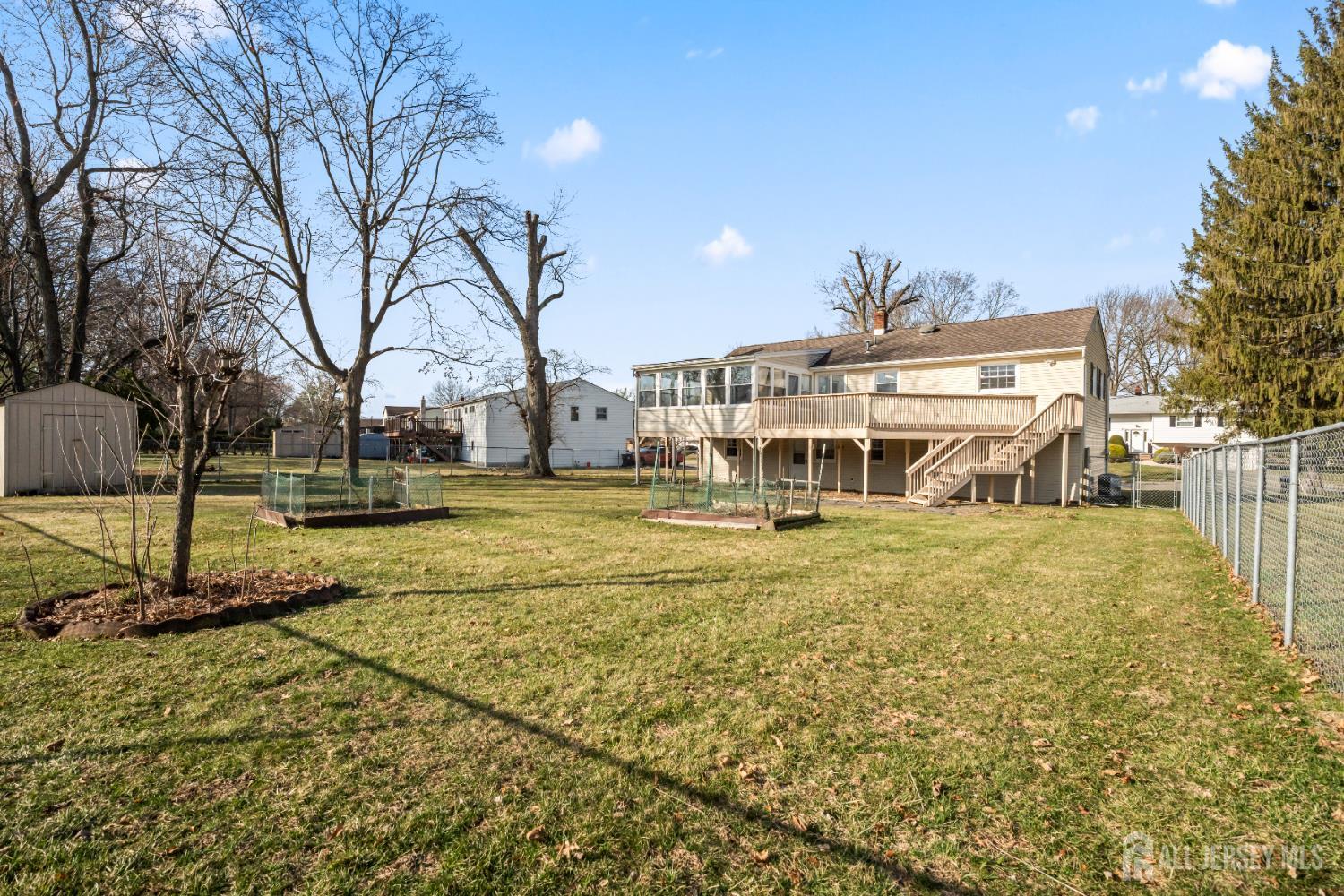 8 Tompkins Road East Brunswick, NJ 08816 - Photo 16 of 22 a front view of a house with a yard