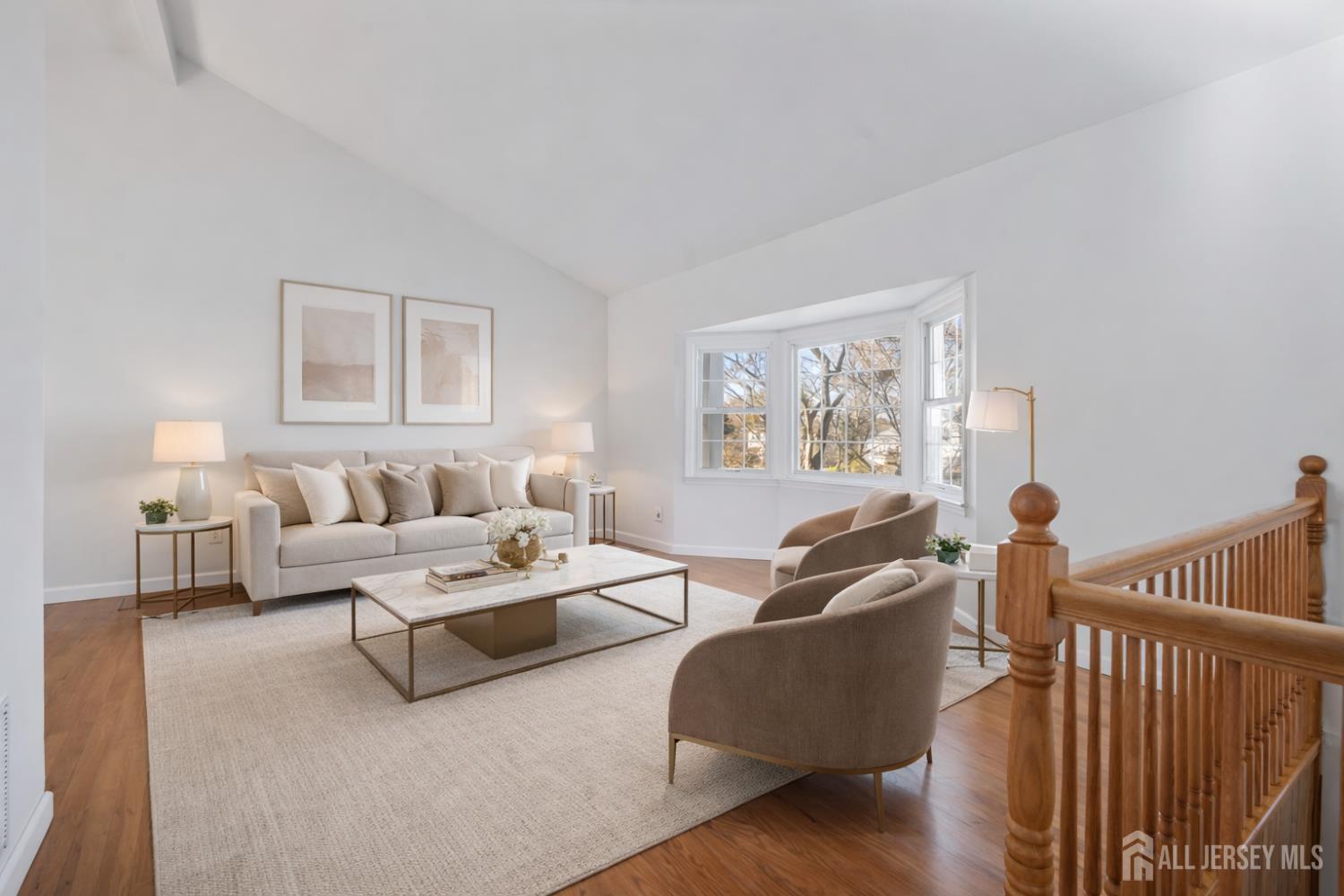 8 Tompkins Road East Brunswick, NJ 08816 - Photo 2 of 22 a living room with furniture and a painting on the wall