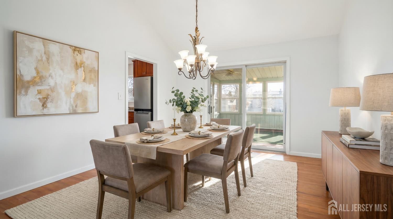 8 Tompkins Road East Brunswick, NJ 08816 - Photo 3 of 22 a view of a dining room with furniture window and wooden floor