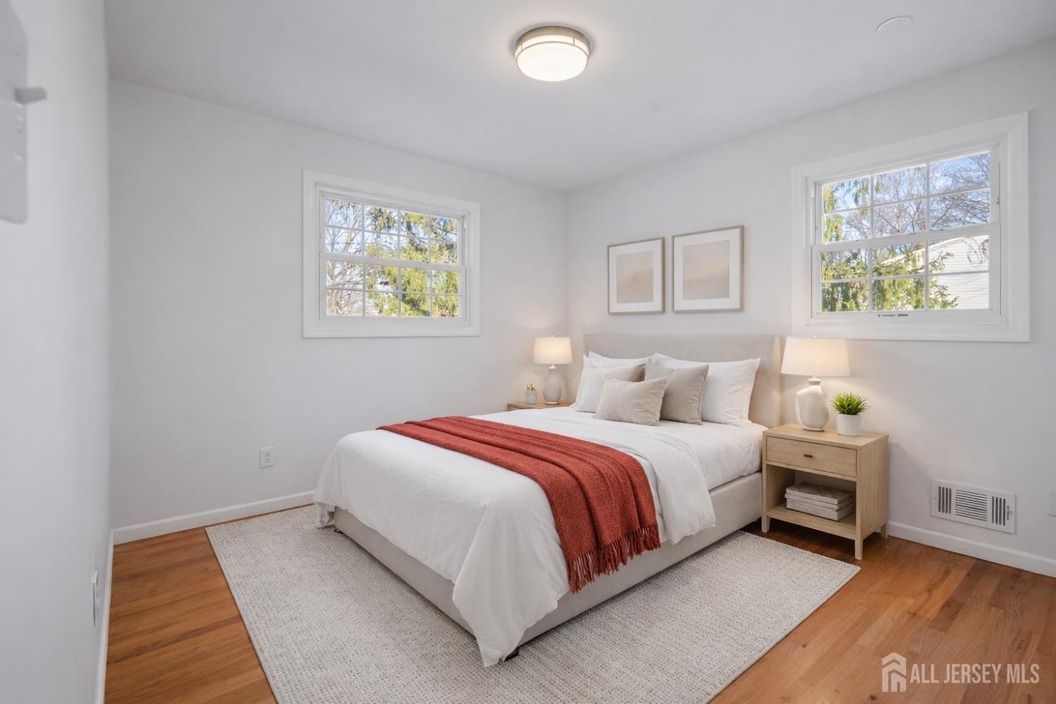 8 Tompkins Road East Brunswick, NJ 08816 - Photo 8 of 22 a bed room with a bed and painting on the wall