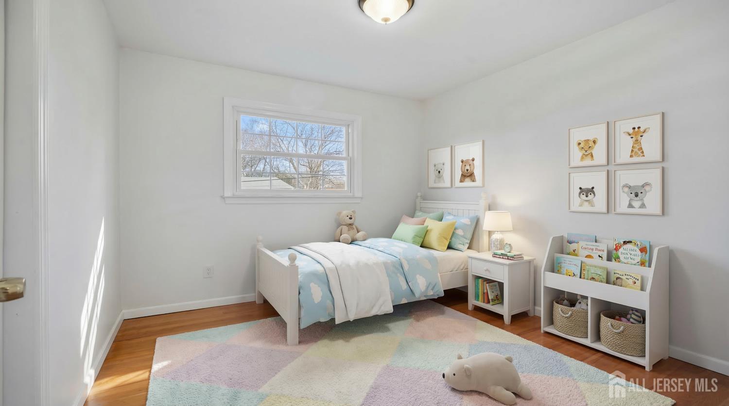 8 Tompkins Road East Brunswick, NJ 08816 - Photo 9 of 22 a spacious bedroom with a bed and a window