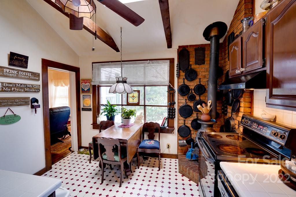 60 Mimosa Inn Drive Tryon, NC 28782 - Photo 14 of 26 a reading room with furniture a rug and a window
