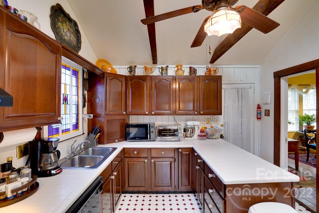60 Mimosa Inn Drive Tryon, NC 28782 - Photo 15 of 26 a kitchen with a sink cabinets and window