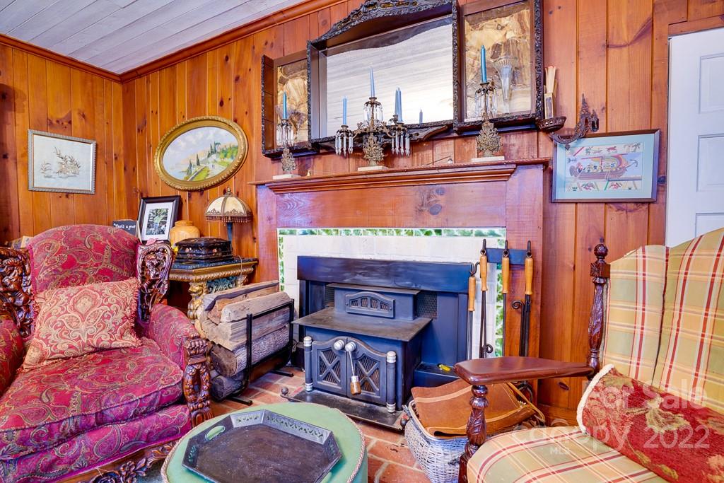 60 Mimosa Inn Drive Tryon, NC 28782 - Photo 17 of 26 a living room with fireplace furniture and a large window