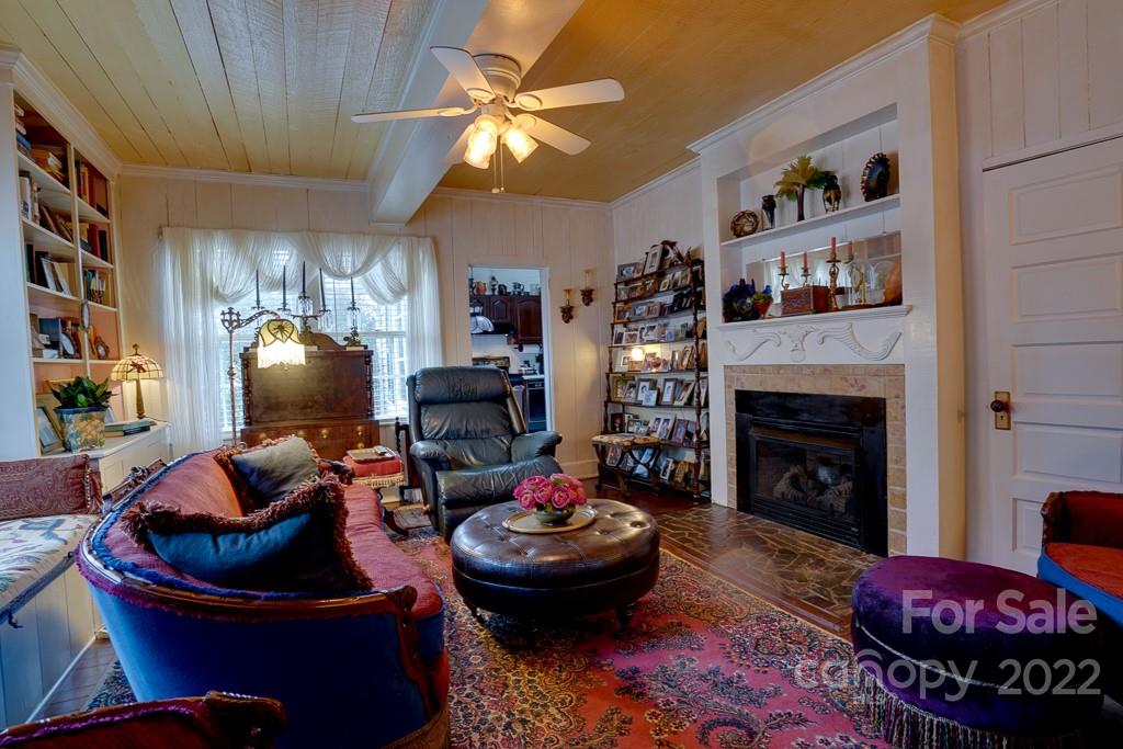 60 Mimosa Inn Drive Tryon, NC 28782 - Photo 2 of 26 a living room with furniture and a fireplace