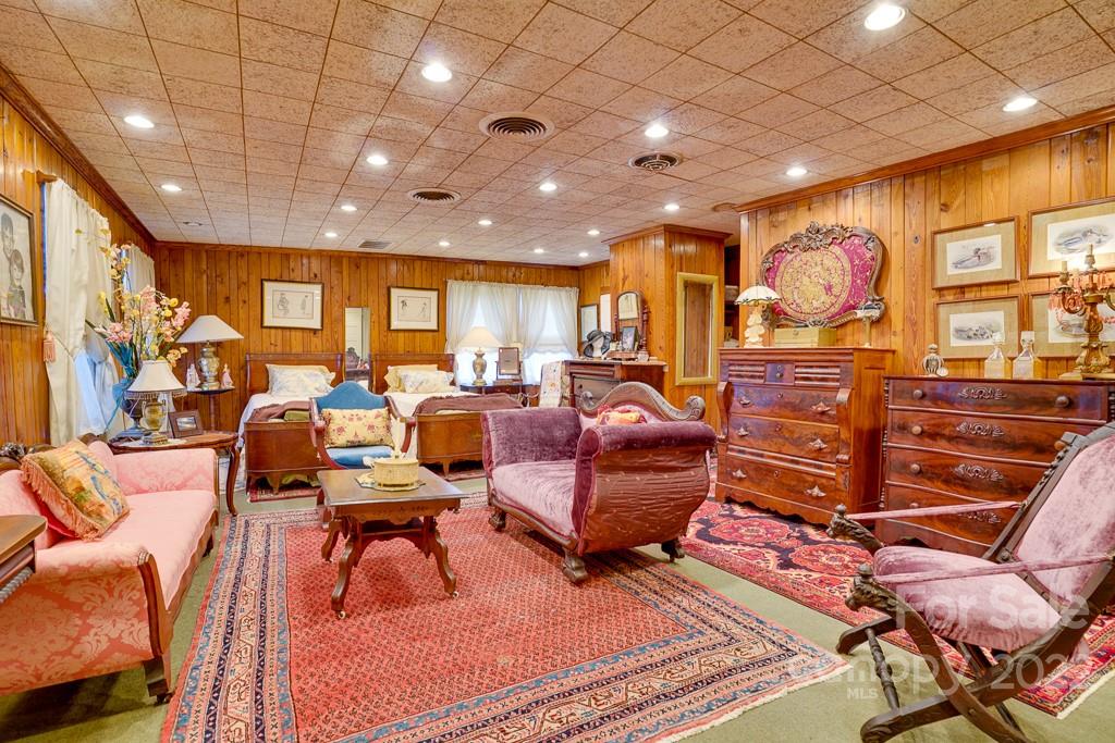 60 Mimosa Inn Drive Tryon, NC 28782 - Photo 21 of 26 a living room with lots of furniture and a large window