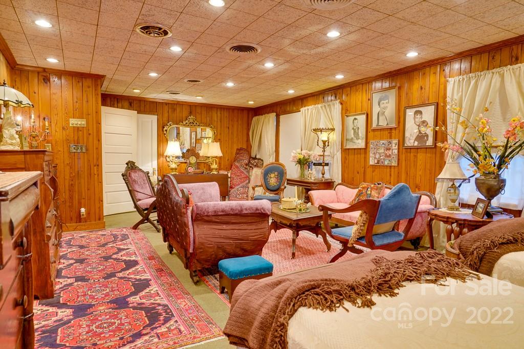 60 Mimosa Inn Drive Tryon, NC 28782 - Photo 22 of 26 a living room with furniture and a large window