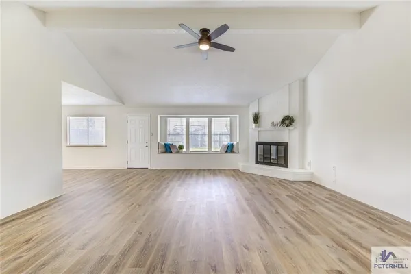 a view of a backyard with a tree