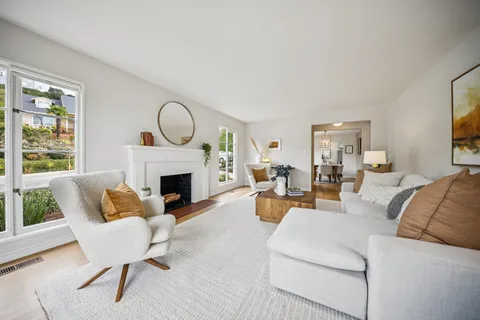 a view of a dining room with furniture window and outside view