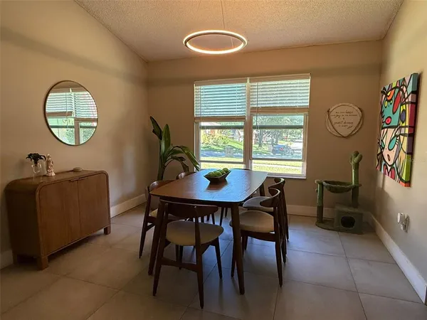 a view of a garage with a flat screen tv and a couch