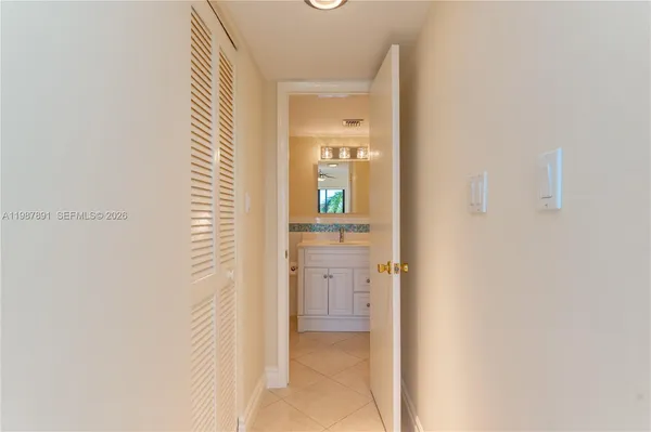 a view of a bathroom from a hallway