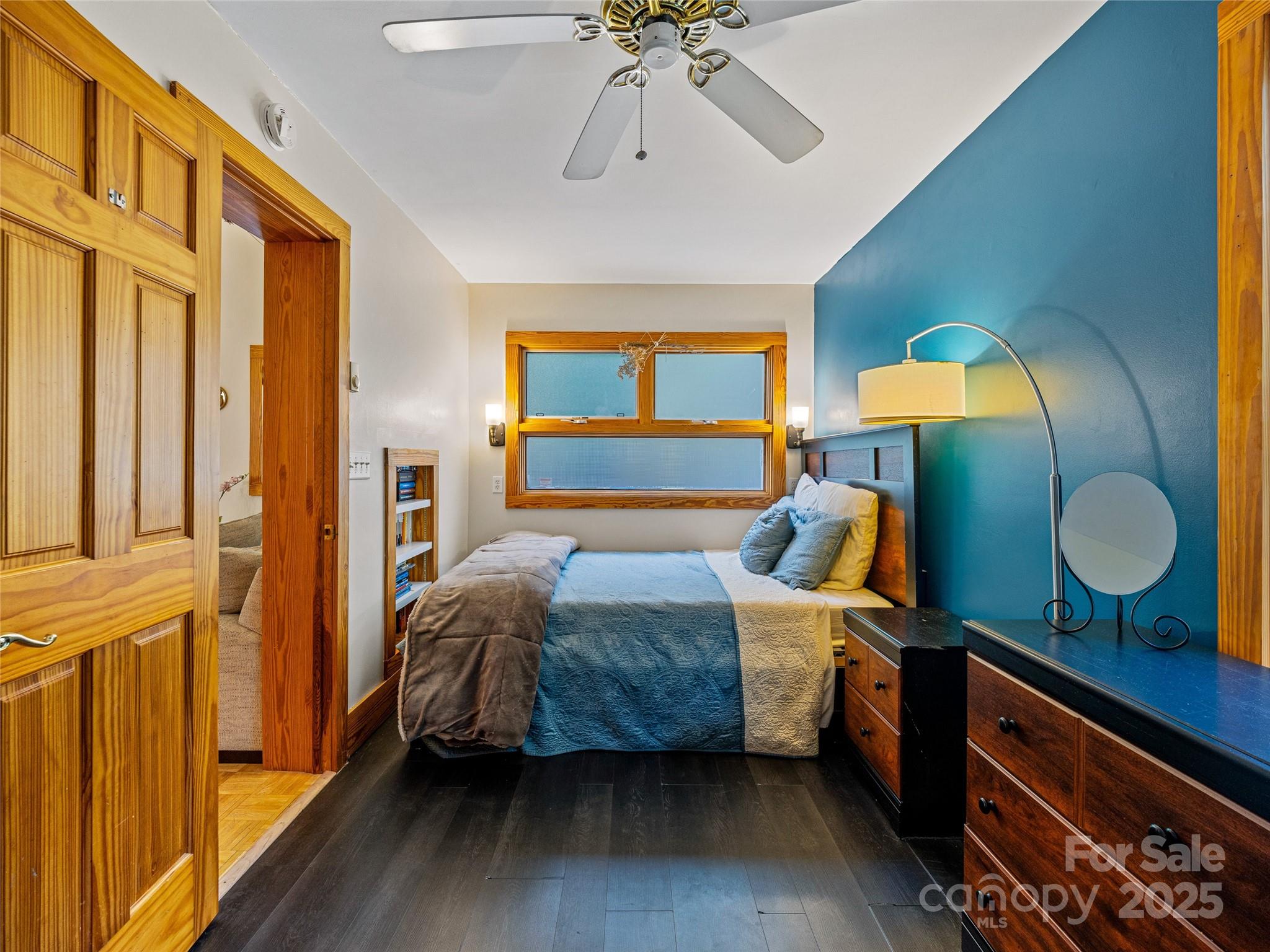 11 Pinewood Road Asheville, NC 28805 - Photo 14 of 31 a bedroom with a bed and wooden floor