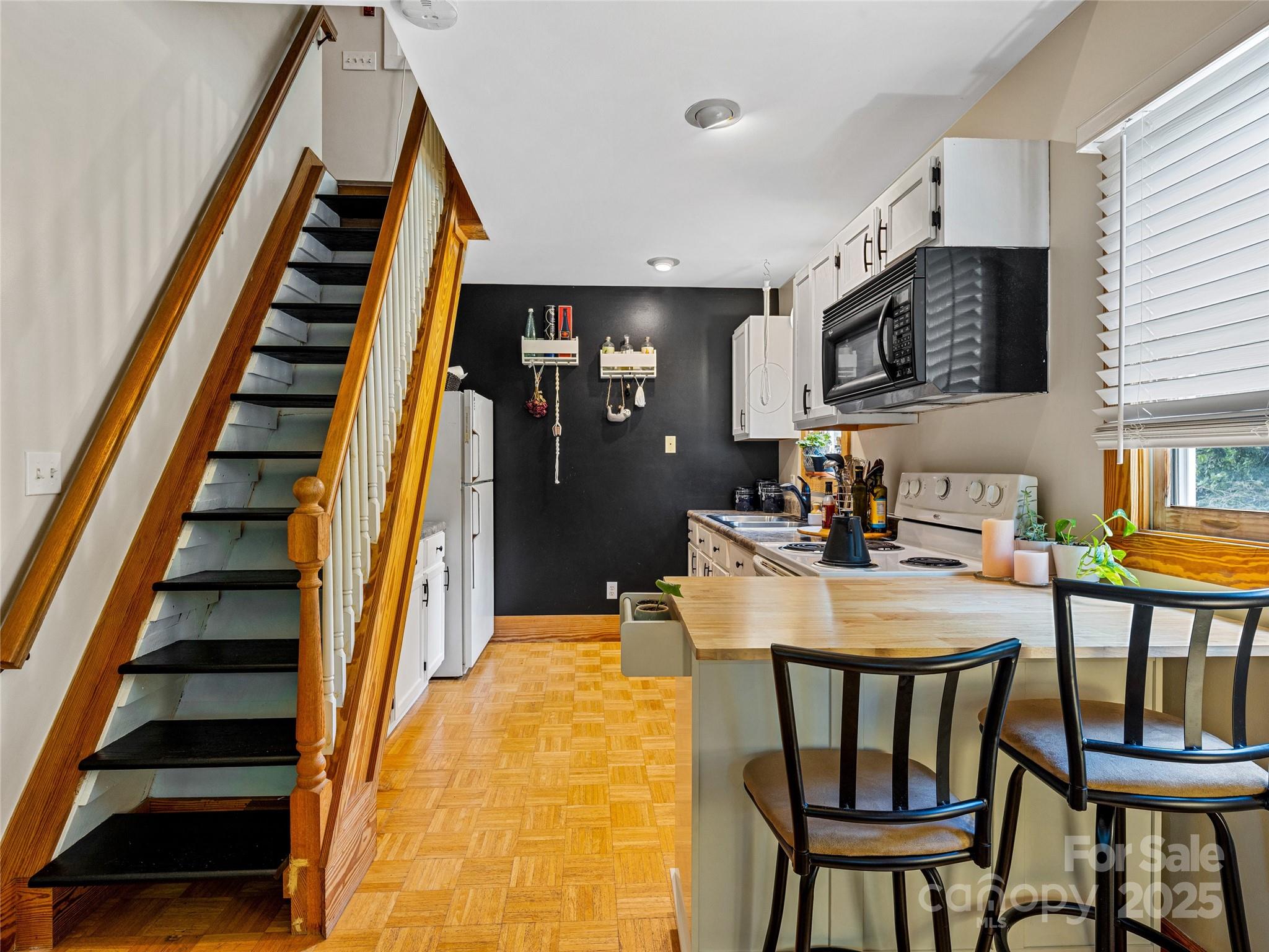 11 Pinewood Road Asheville, NC 28805 - Photo 10 of 31 a dining room with furniture and wooden floor