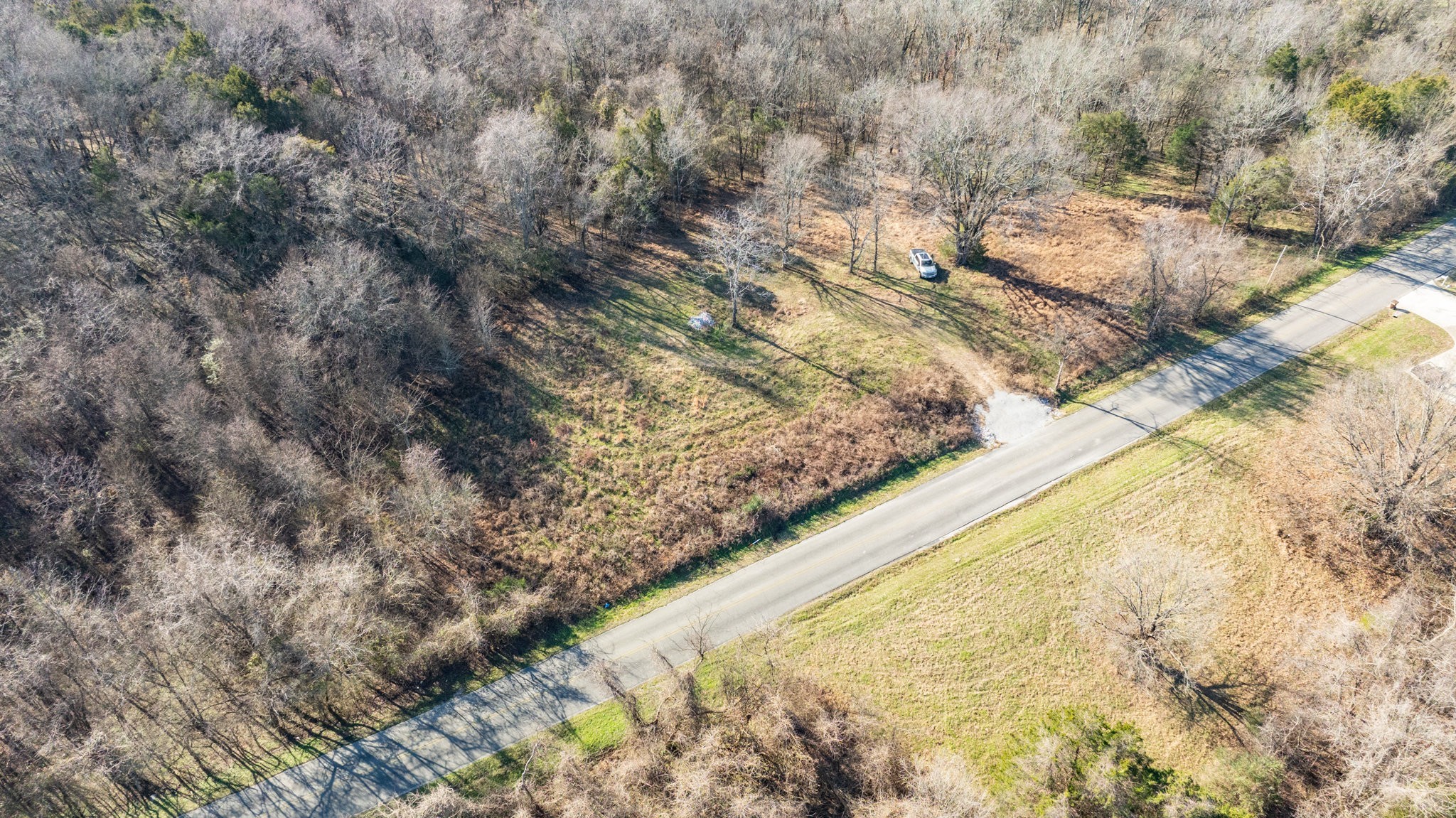 0 Nicholson Schoolhouse Road Columbia, TN 38401 - Photo 3 of 15 a view of a dry yard with wooden fence