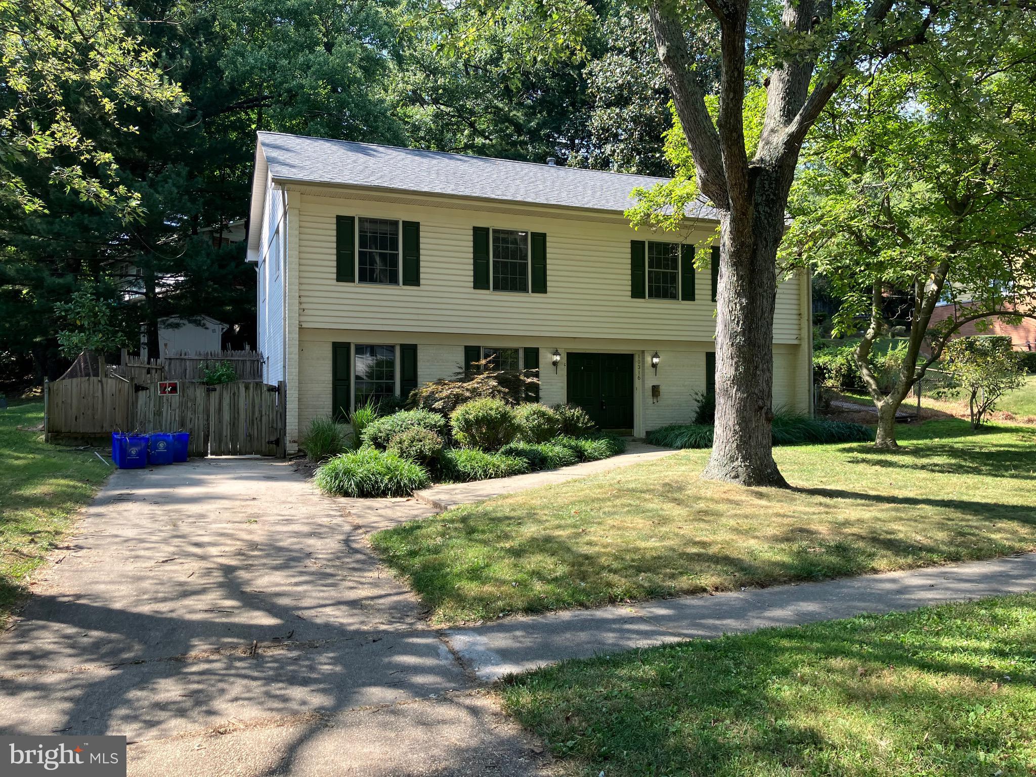 10316 Royal Road Silver Spring, MD 20903 - Photo 1 of 46 a front view of a house with a yard and garage