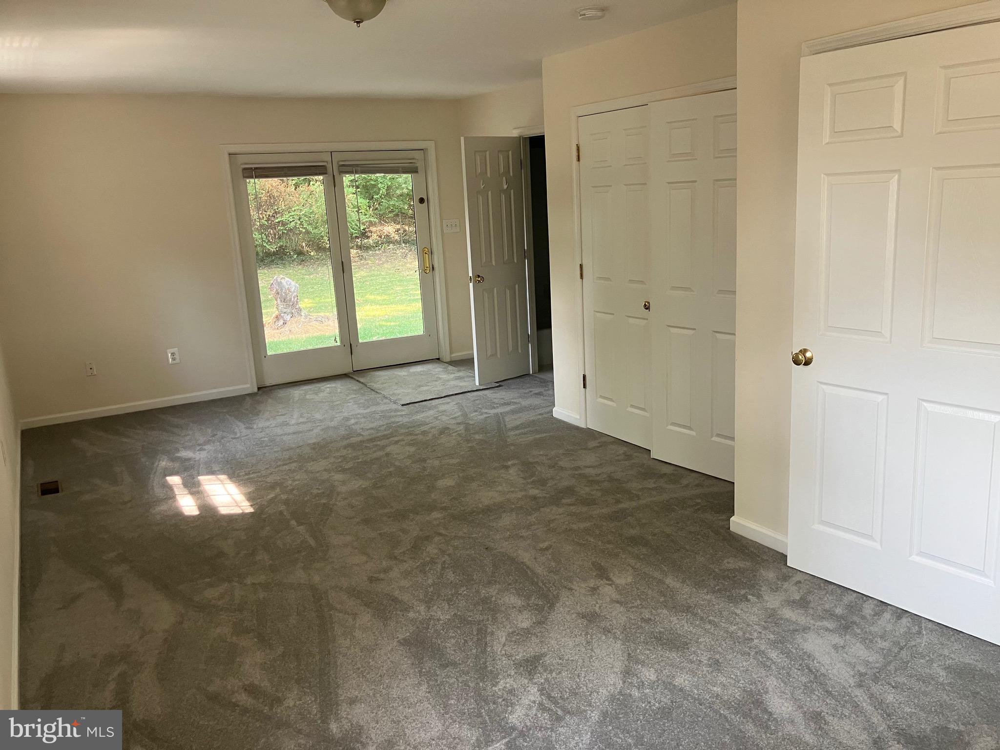 10316 Royal Road Silver Spring, MD 20903 - Photo 25 of 46 an empty room with windows and closet