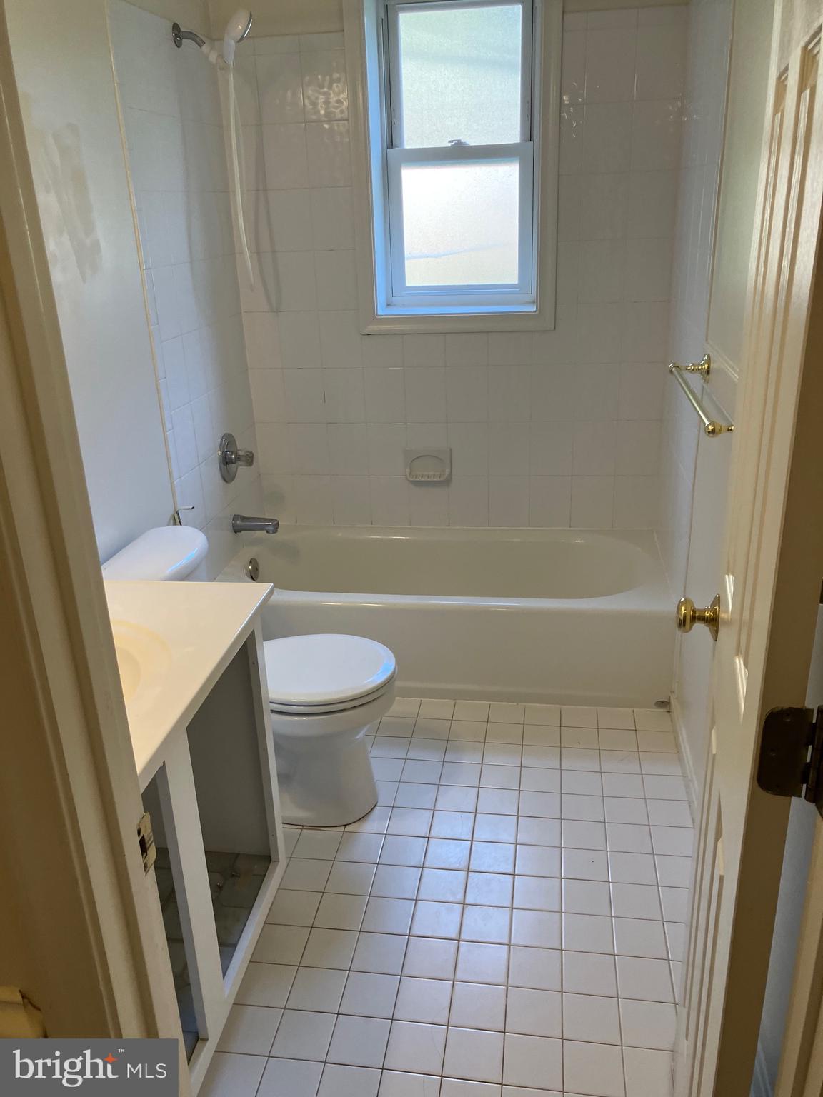 10316 Royal Road Silver Spring, MD 20903 - Photo 26 of 46 a bathroom with a sink a toilet and bathtub