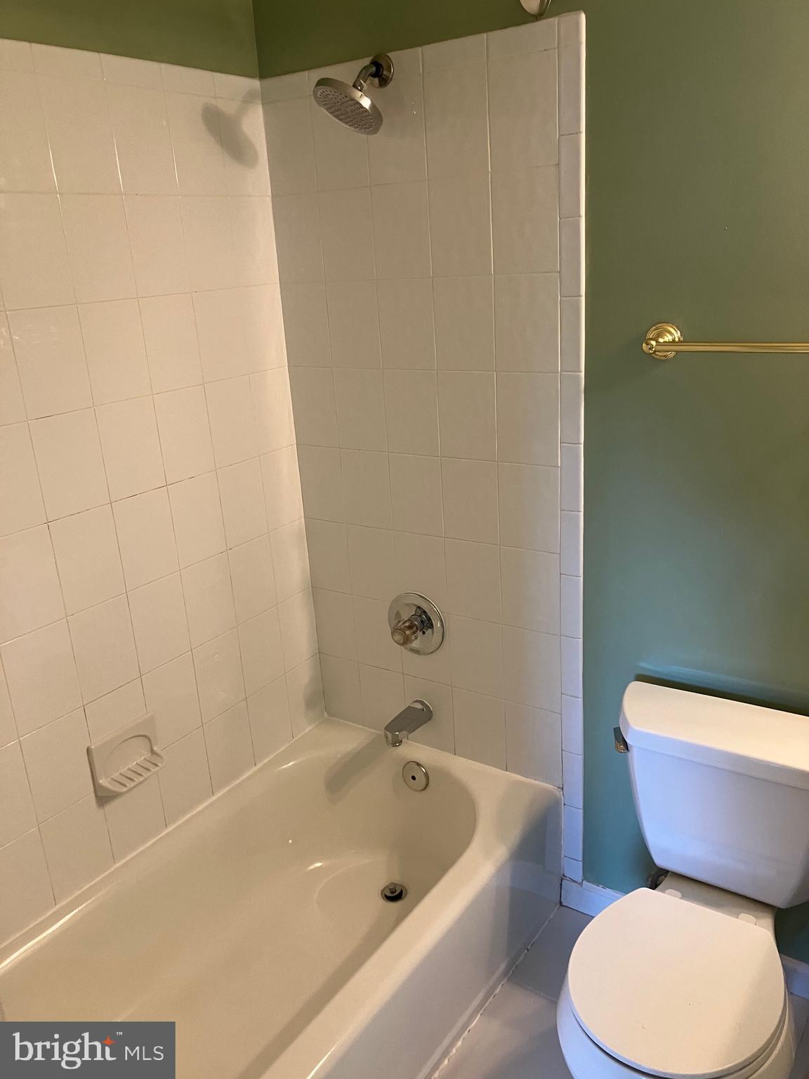 10316 Royal Road Silver Spring, MD 20903 - Photo 29 of 46 a white toilet sitting next to a bath tub